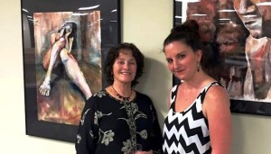 Students Joi Hosker, left, and Amber Bailey at their art opening as part of their JU MFA Visual Arts degree work.