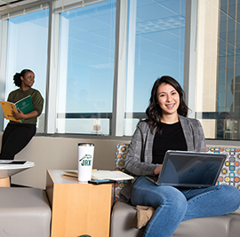 In-text image of two women in an office building.