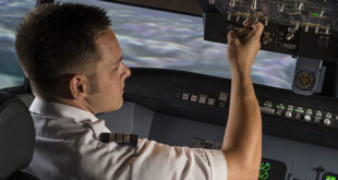 Article feature image of man in cockpit of plane
