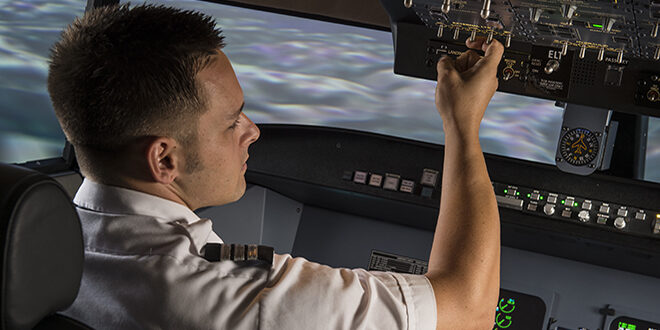 Article feature image of man in cockpit of plane