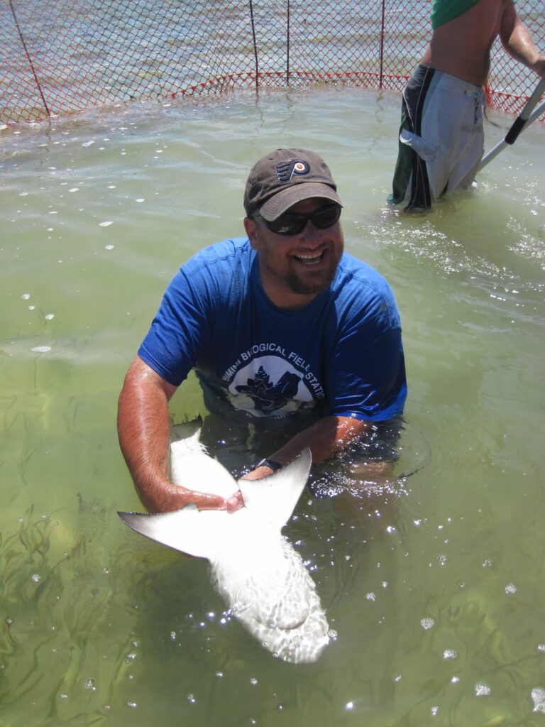 Image of Dr. Bryan Franks holding small shark