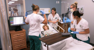 Students tending to a "patient"