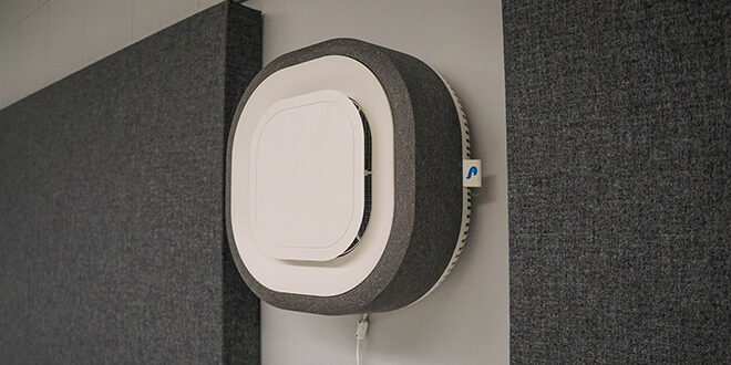 Photo of Aura Air Filter on a Wall in a classroom on campus